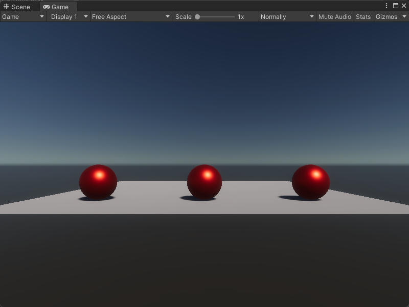 An image of the Game view, that displays a simple plane with three red spheres.